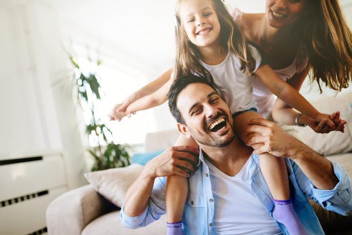 Happy family having fun times at home together