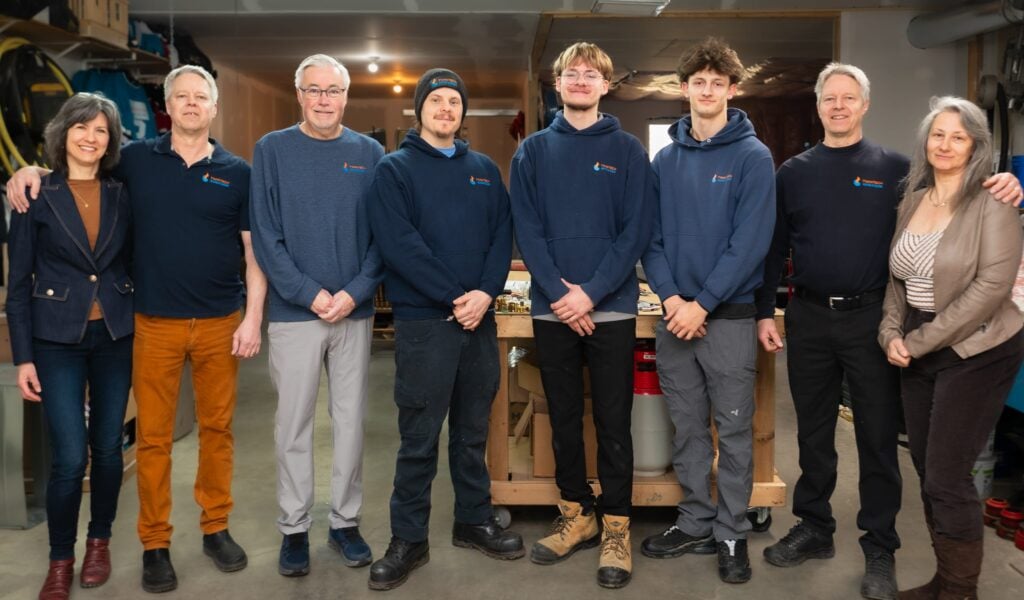 The Twintech Heating and Cooling team posing in their HVAC workshop in Durham Region, Ontario.